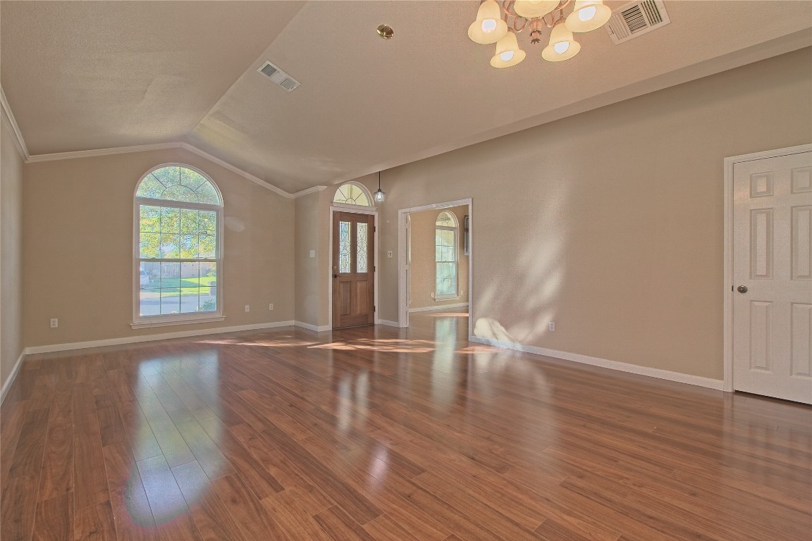 3112 Clinton Place Round Rock, TX 78665 - Photo 7 of 36 an empty room with wooden floor and windows
