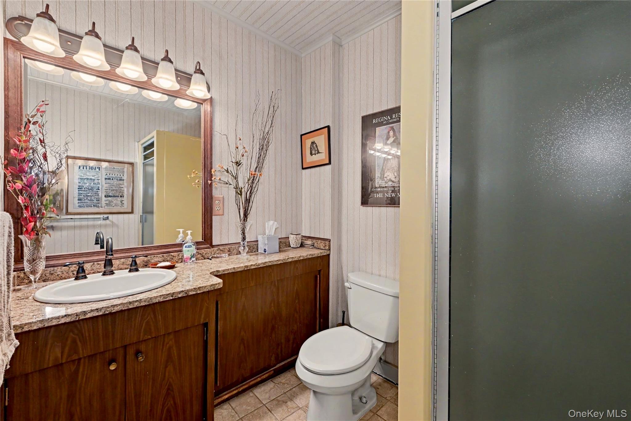 631 Croton Falls Road Carmel, NY 10512 - Photo 22 of 43 a bathroom with a granite countertop toilet sink and mirror