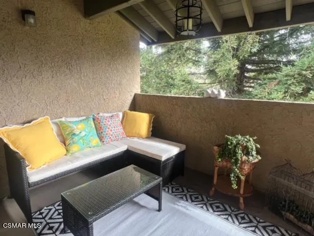 a outdoor living space with furniture and a potted plant