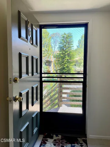 a view of a house with a door and a window