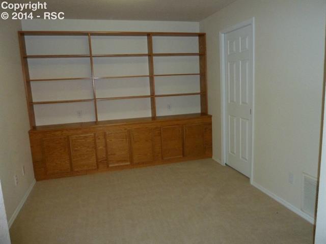 7625 Julynn Road Colorado Springs, CO 80919 - Photo 26 of 34 Office with built in cabinets , shelves and closet
