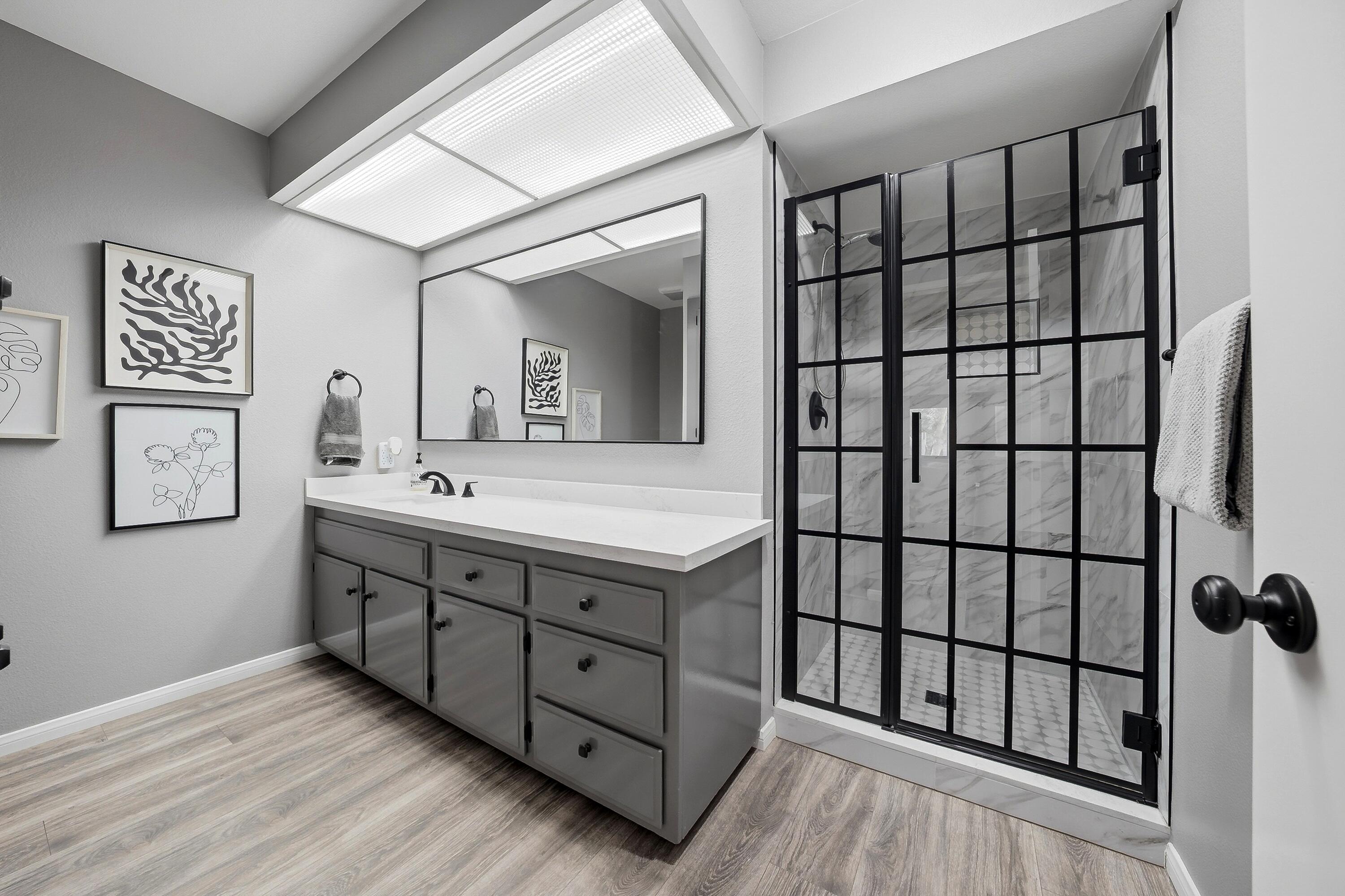 71870 Eleanora Lane Rancho Mirage, CA 92270 - Photo 20 of 36 a bathroom with a double vanity sink and a large mirror