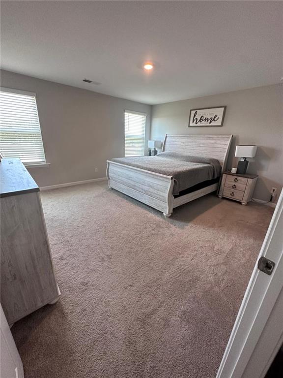 53 Seed Lane Pendergrass, GA 30567 - Photo 12 of 22 a spacious bedroom with a bed and a window