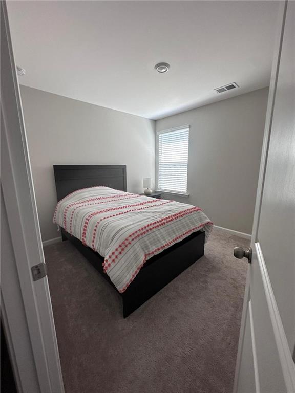 53 Seed Lane Pendergrass, GA 30567 - Photo 15 of 22 a bedroom with a bed and a window