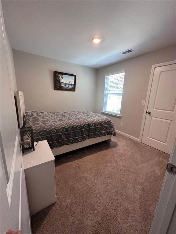 53 Seed Lane Pendergrass, GA 30567 - Photo 17 of 22 a living room with a couch and a window