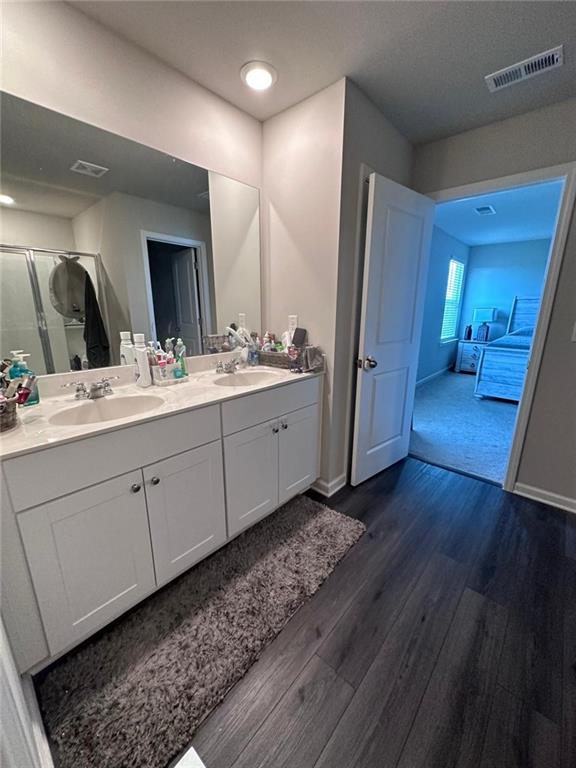 53 Seed Lane Pendergrass, GA 30567 - Photo 19 of 22 a bathroom with a double vanity sink and a mirror
