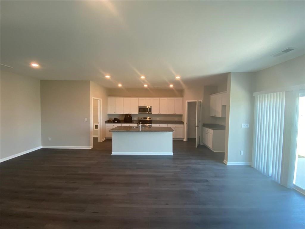 53 Seed Lane Pendergrass, GA 30567 - Photo 4 of 22 a view of kitchen with kitchen island wooden cabinets and refrigerator
