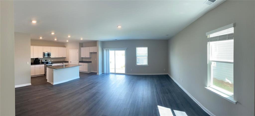 53 Seed Lane Pendergrass, GA 30567 - Photo 5 of 22 a view of kitchen with wooden floor and electronic appliances