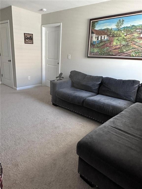 53 Seed Lane Pendergrass, GA 30567 - Photo 6 of 22 a living room with couches and a painting on the wall