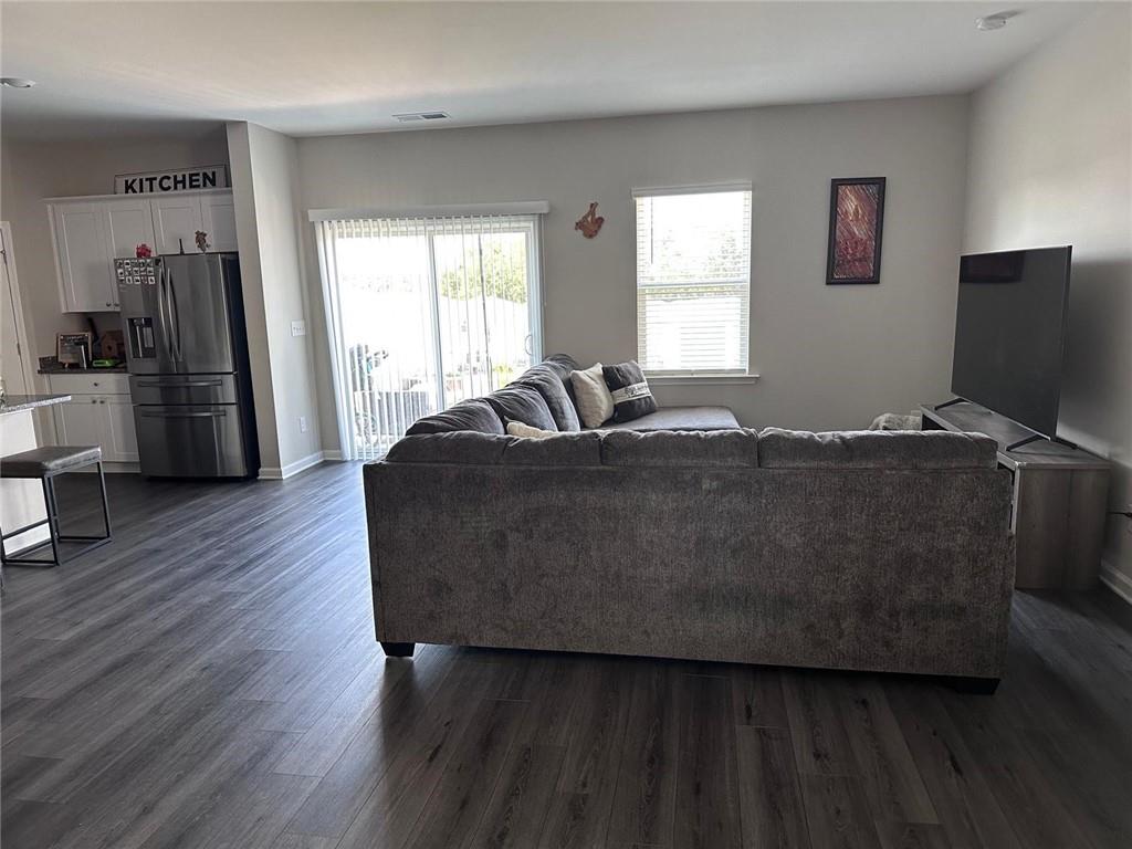 53 Seed Lane Pendergrass, GA 30567 - Photo 8 of 22 a living room with a bed furniture and a window