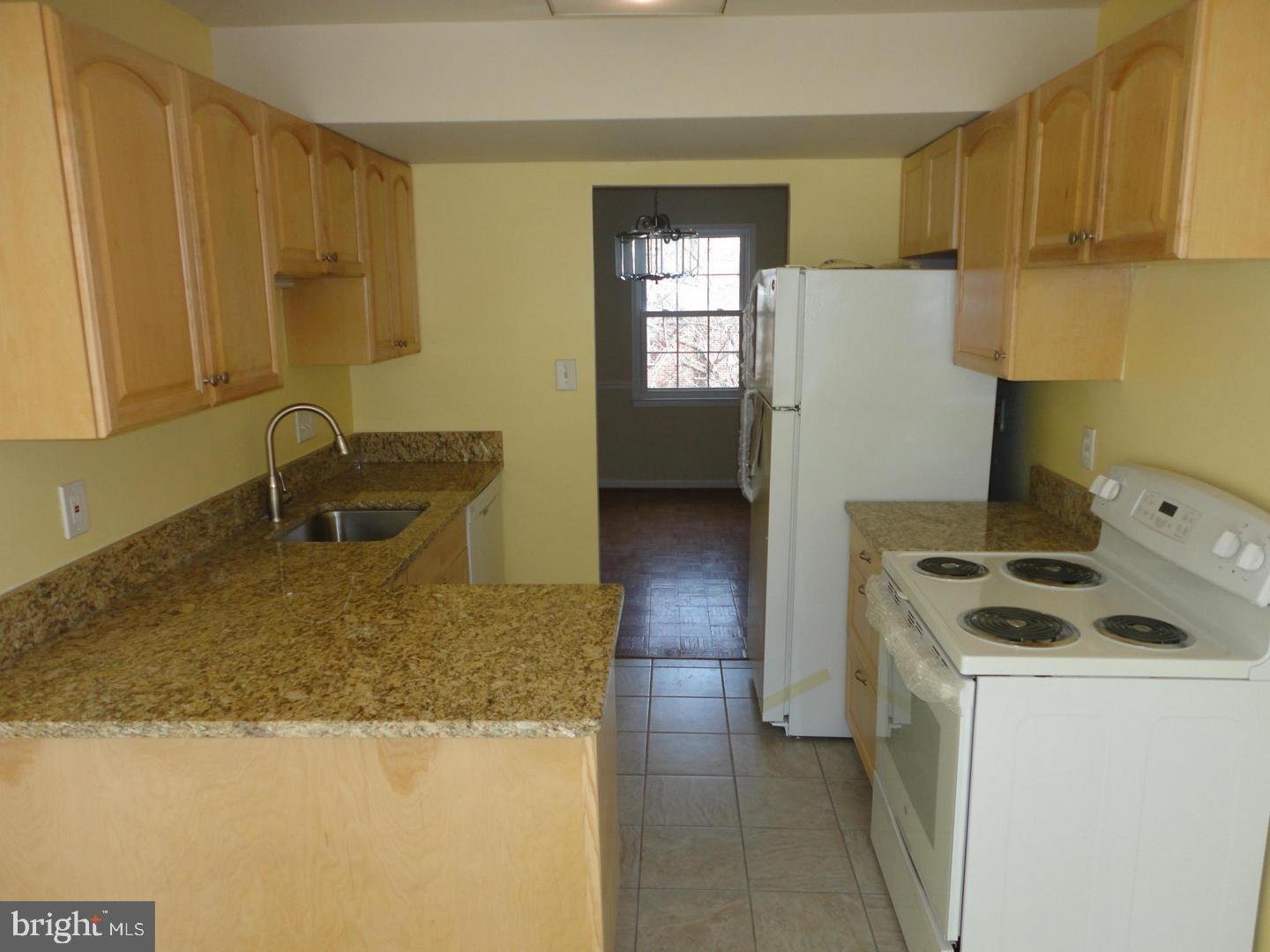 9120 Conservation Way Springfield, VA 22153 - Photo 3 of 19 a kitchen that has a sink and a stove