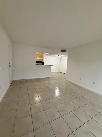 a view of a livingroom and window