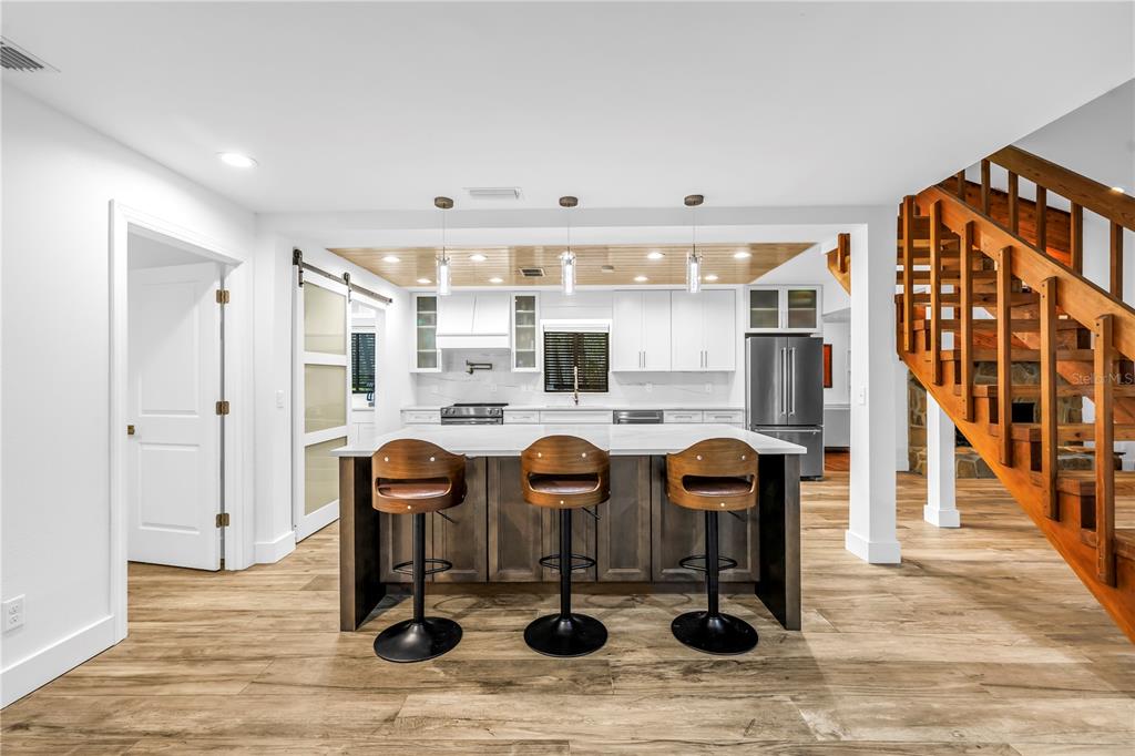 4605 Stone Ridge Trail Sarasota, FL 34232 - Photo 14 of 56 a kitchen with granite countertop a table and chairs