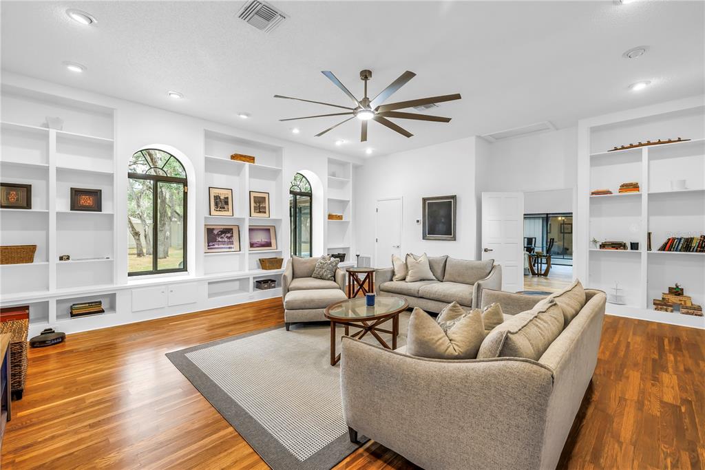 4605 Stone Ridge Trail Sarasota, FL 34232 - Photo 20 of 56 a living room with furniture kitchen view and a large window