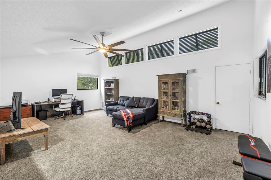 4605 Stone Ridge Trail Sarasota, FL 34232 - Photo 26 of 56 a living room with furniture and a window