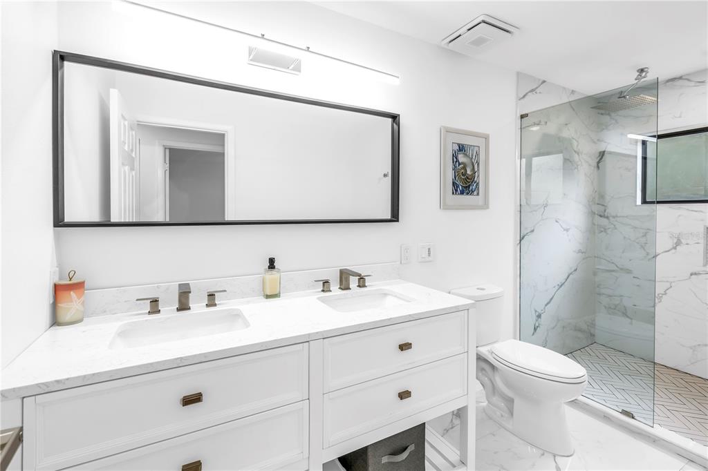 4605 Stone Ridge Trail Sarasota, FL 34232 - Photo 37 of 56 a bathroom with a toilet sink and mirror