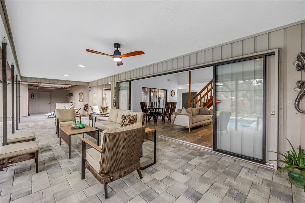 4605 Stone Ridge Trail Sarasota, FL 34232 - Photo 41 of 56 a view of a dining room with furniture a rug and white walls