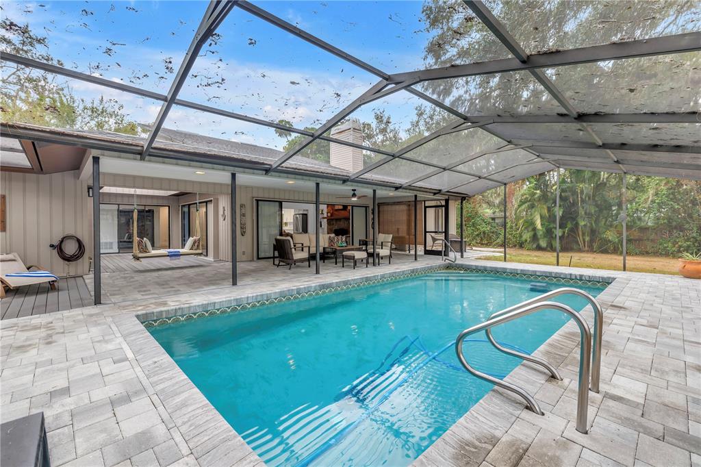 4605 Stone Ridge Trail Sarasota, FL 34232 - Photo 42 of 56 a view of a swimming pool with a patio
