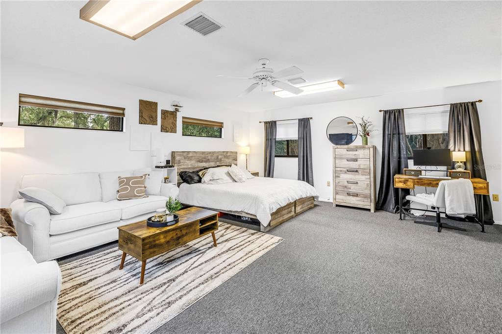 4605 Stone Ridge Trail Sarasota, FL 34232 - Photo 44 of 56 a bedroom with a bed and gym equipment