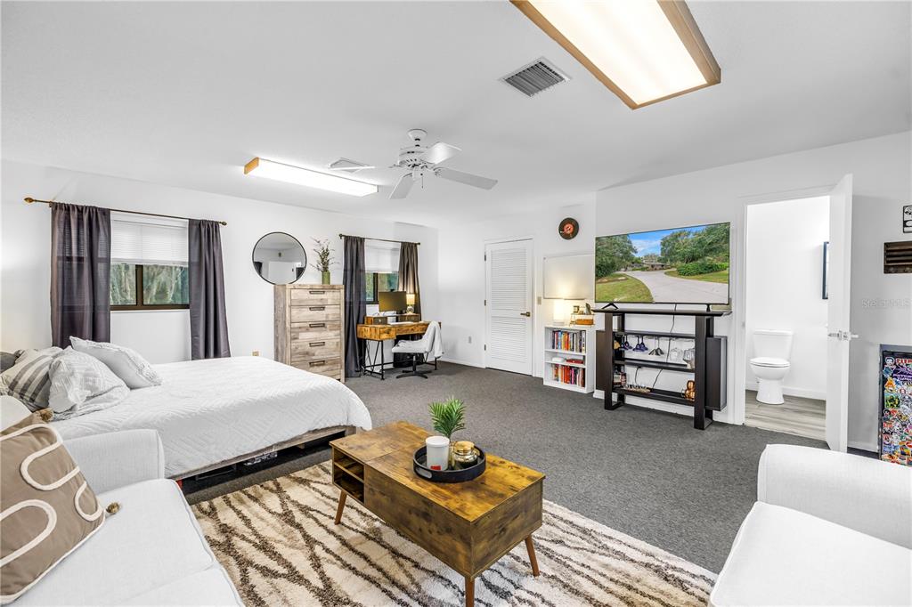 4605 Stone Ridge Trail Sarasota, FL 34232 - Photo 45 of 56 a bedroom with a bed furniture and a large window