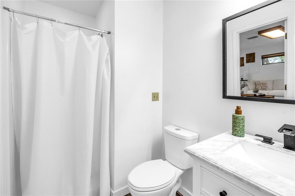 4605 Stone Ridge Trail Sarasota, FL 34232 - Photo 48 of 56 a bathroom with a granite countertop sink and a toilet