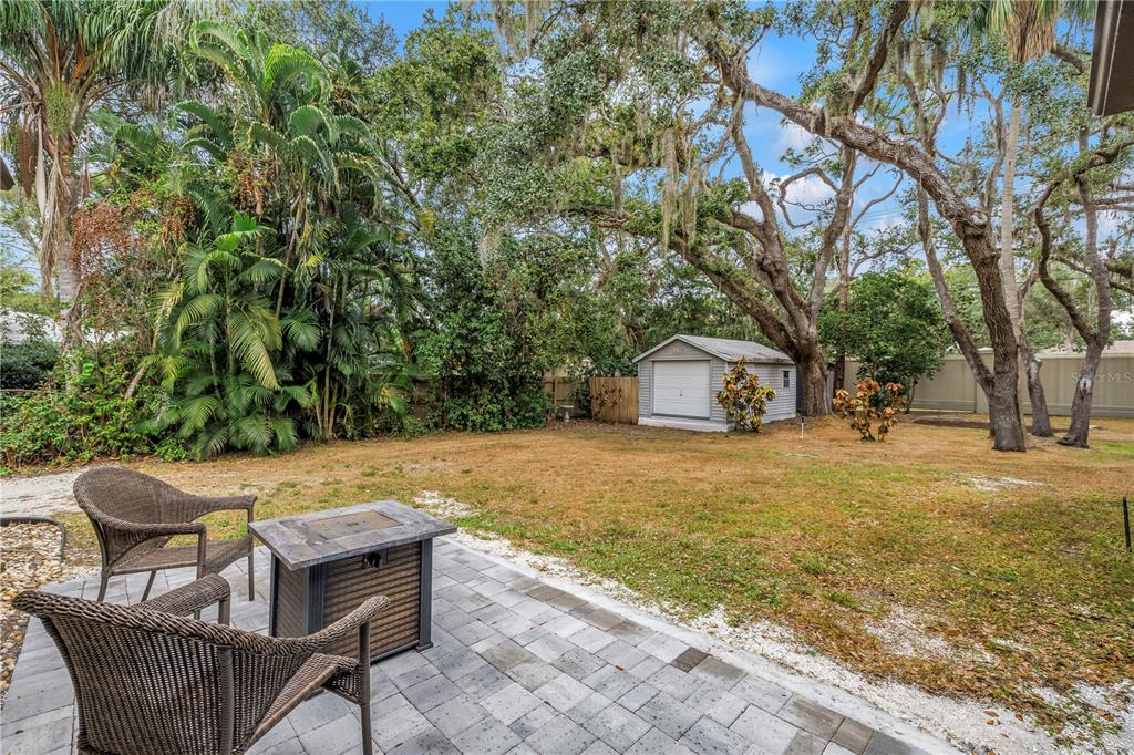 4605 Stone Ridge Trail Sarasota, FL 34232 - Photo 51 of 56 a view of a chairs and table in the backyard