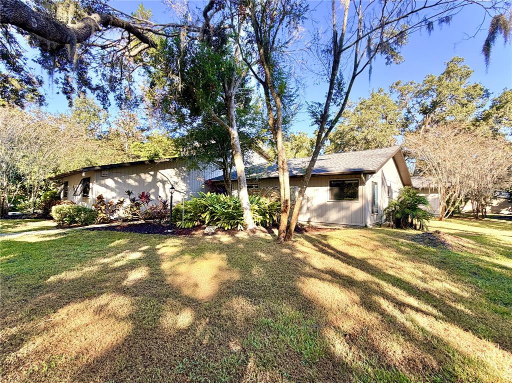 4605 Stone Ridge Trail Sarasota, FL 34232 - Photo 56 of 56 a view of a house with a yard and pathway