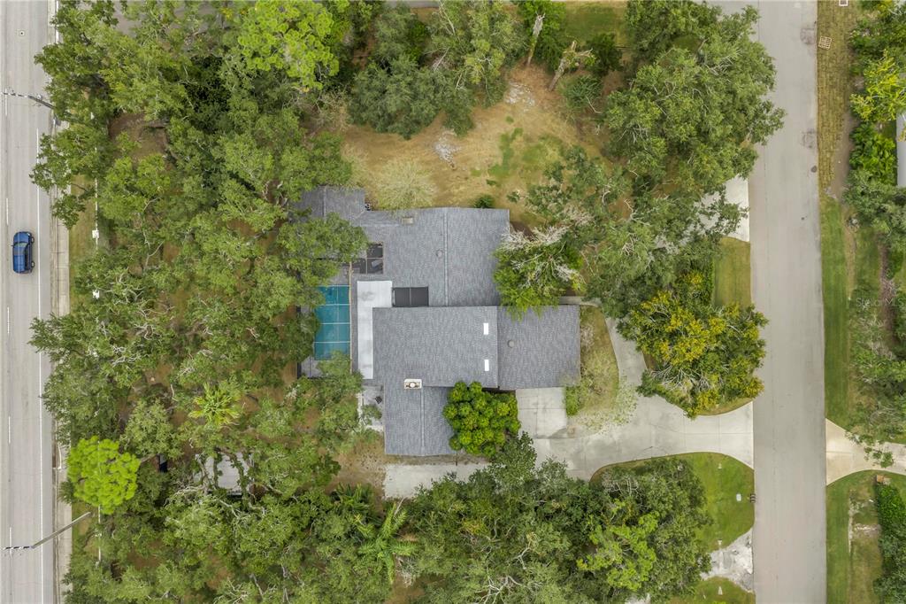4605 Stone Ridge Trail Sarasota, FL 34232 - Photo 9 of 56 an aerial view of a house with trees all around