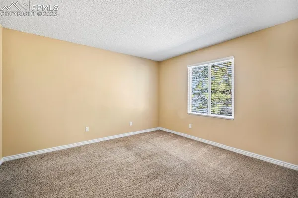 an empty room with a empty space and a window