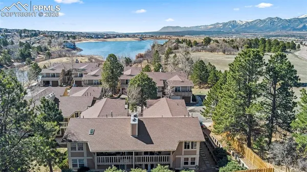 an aerial view of a house with a lake view