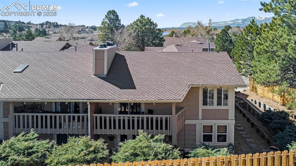1682 Deer Creek Road Monument, CO 80132 - Photo 28 of 38 a roof deck with table and chairs