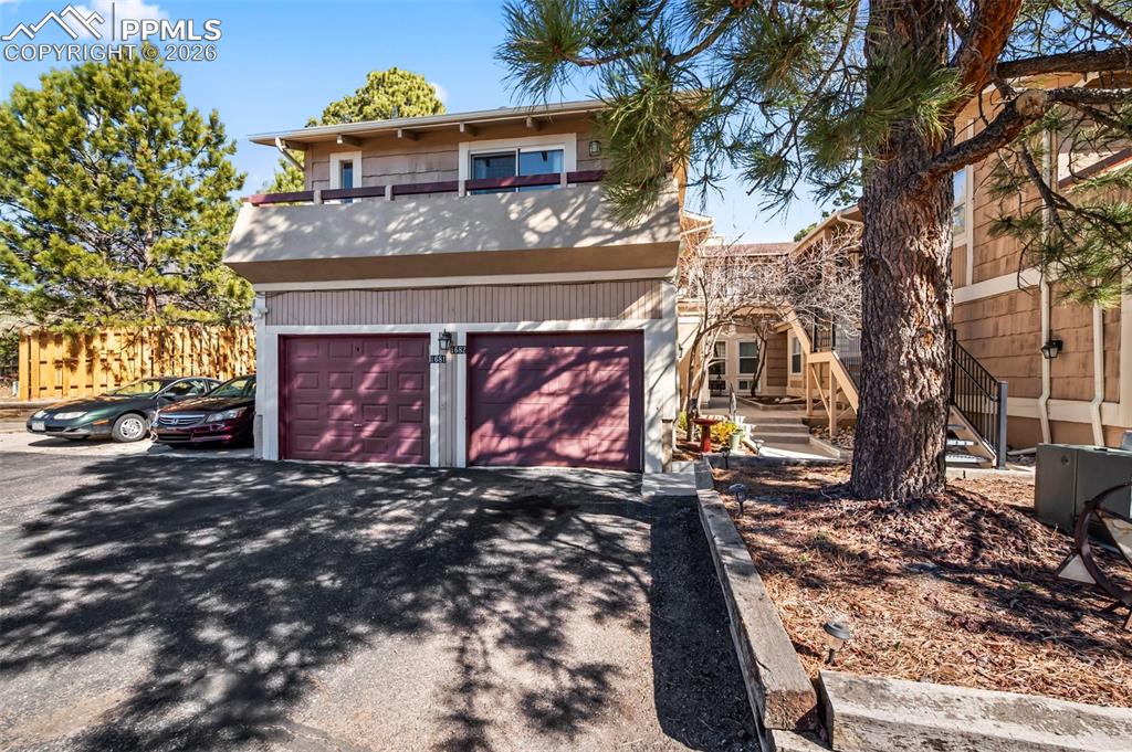 1682 Deer Creek Road Monument, CO 80132 - Photo 32 of 38 a view of a house with a yard and tree s