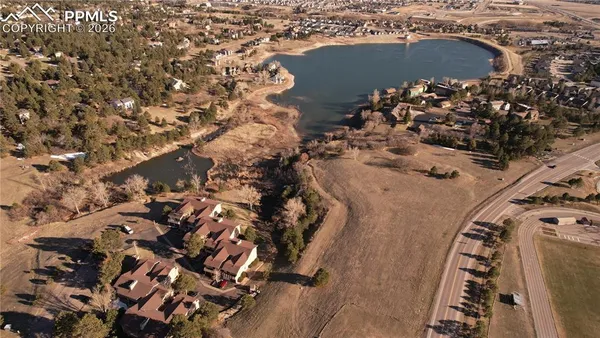 an aerial view of house with yard