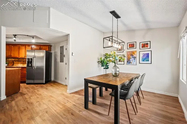 a dining room with furniture and window