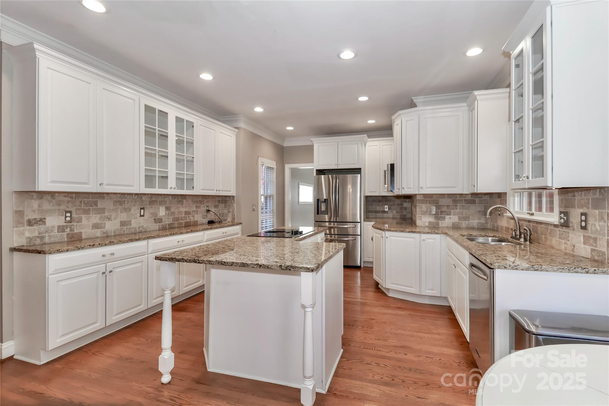 625 St Andrews Road Statesville, NC 28625 - Photo 16 of 48 a kitchen with a sink stove cabinets and chairs