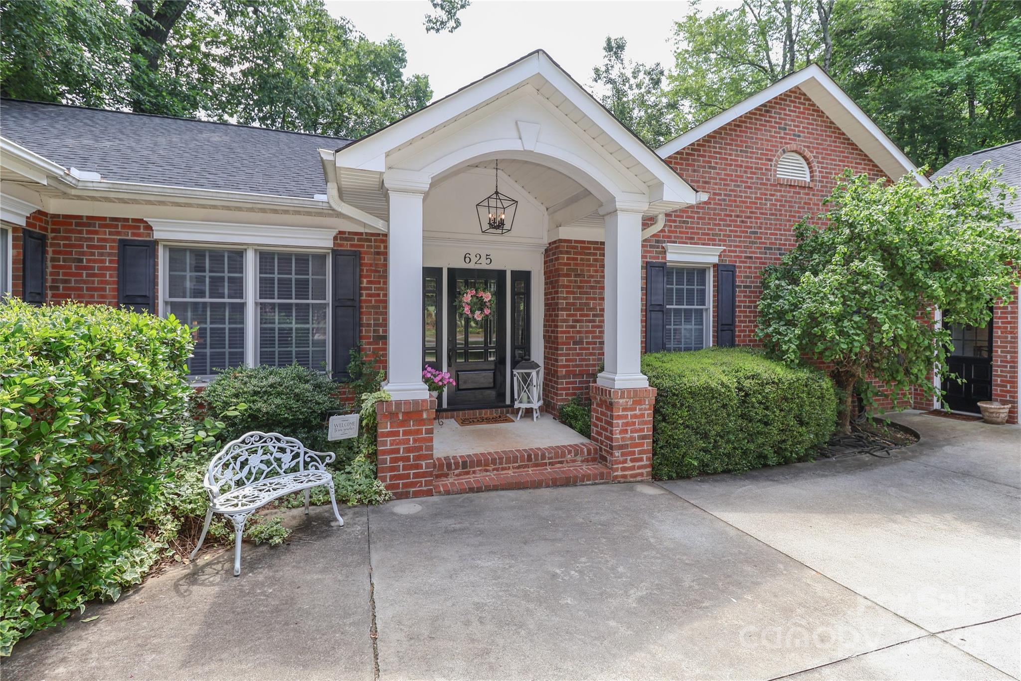 625 St Andrews Road Statesville, NC 28625 - Photo 3 of 48 a view of a house with a yard plants and a large tree
