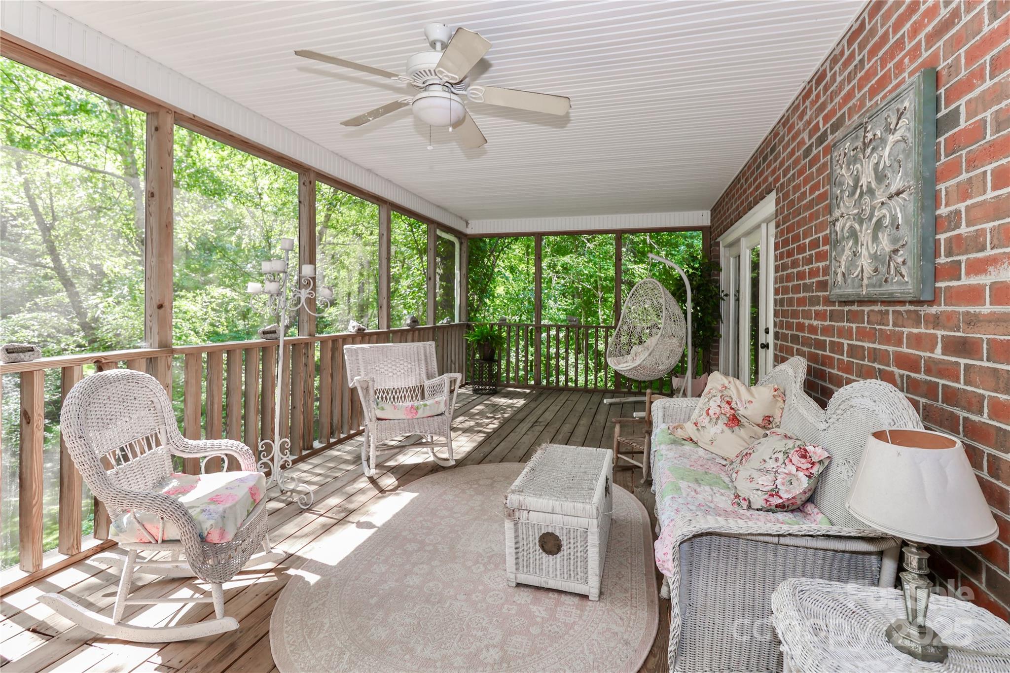 625 St Andrews Road Statesville, NC 28625 - Photo 32 of 48 a living room with furniture and floor to ceiling windows