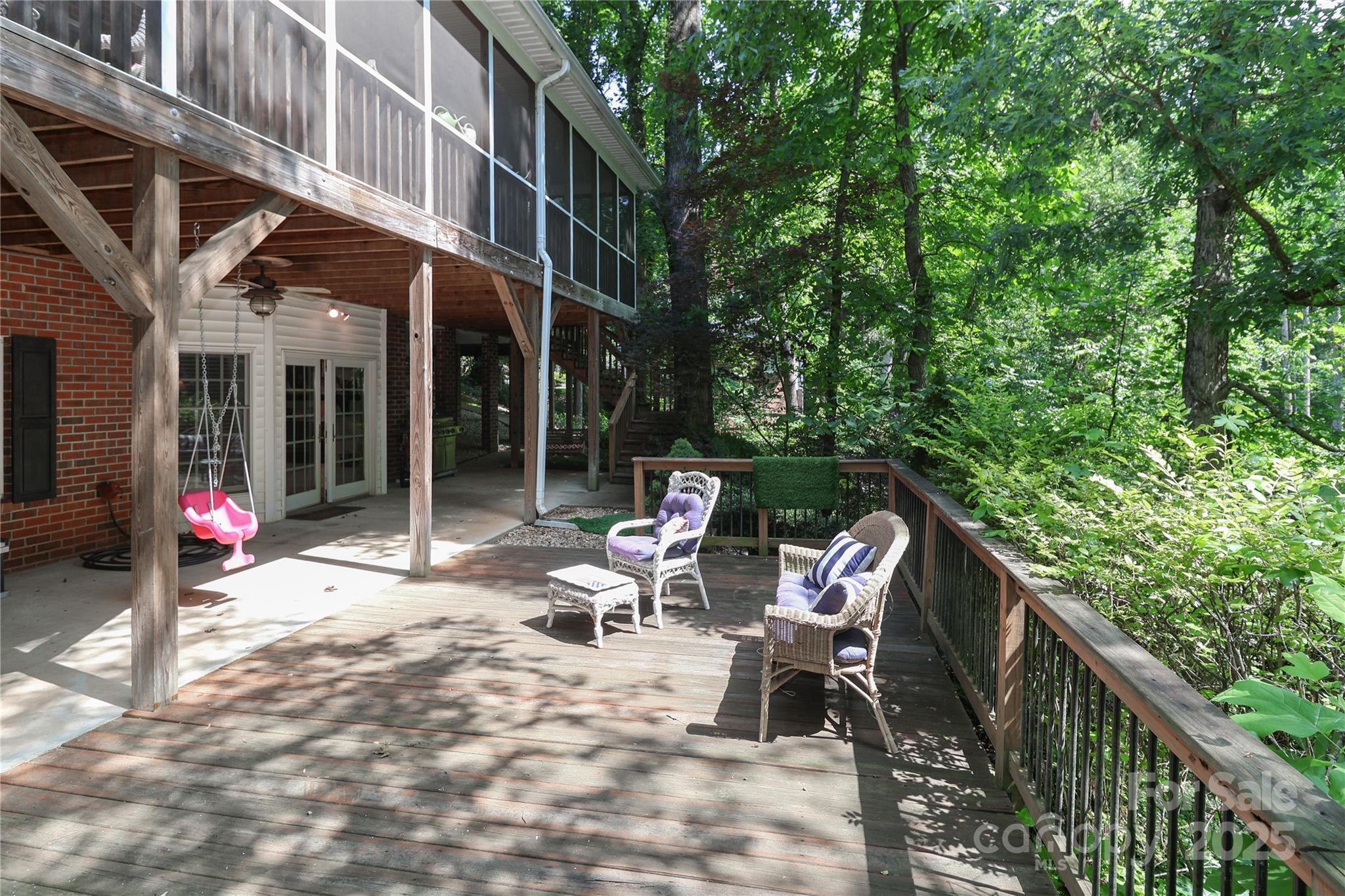 625 St Andrews Road Statesville, NC 28625 - Photo 45 of 48 a view of a patio with table and chairs and wooden fence