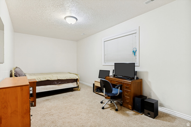 298 North Canyon Road Bountiful, UT 84010 - Photo 47 of 57 Carpeted room featuring white walls, a single window with blinds, and a built-in ceiling light fixture