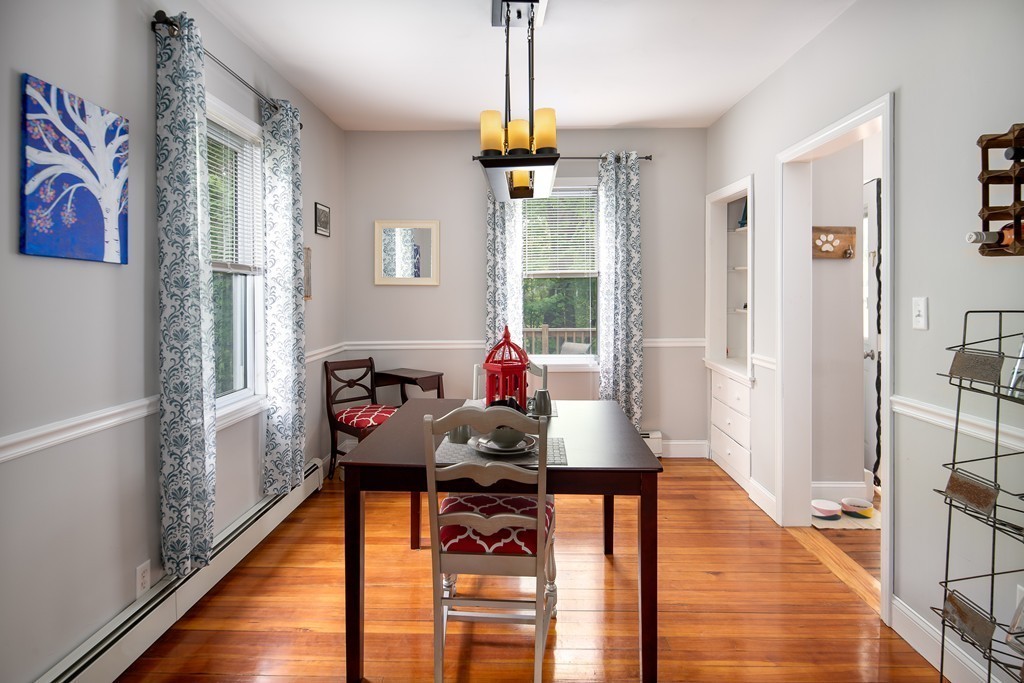 79 Colonial Drive Dedham, MA 02026 - Photo 2 of 12 a living room with furniture and a wooden floor