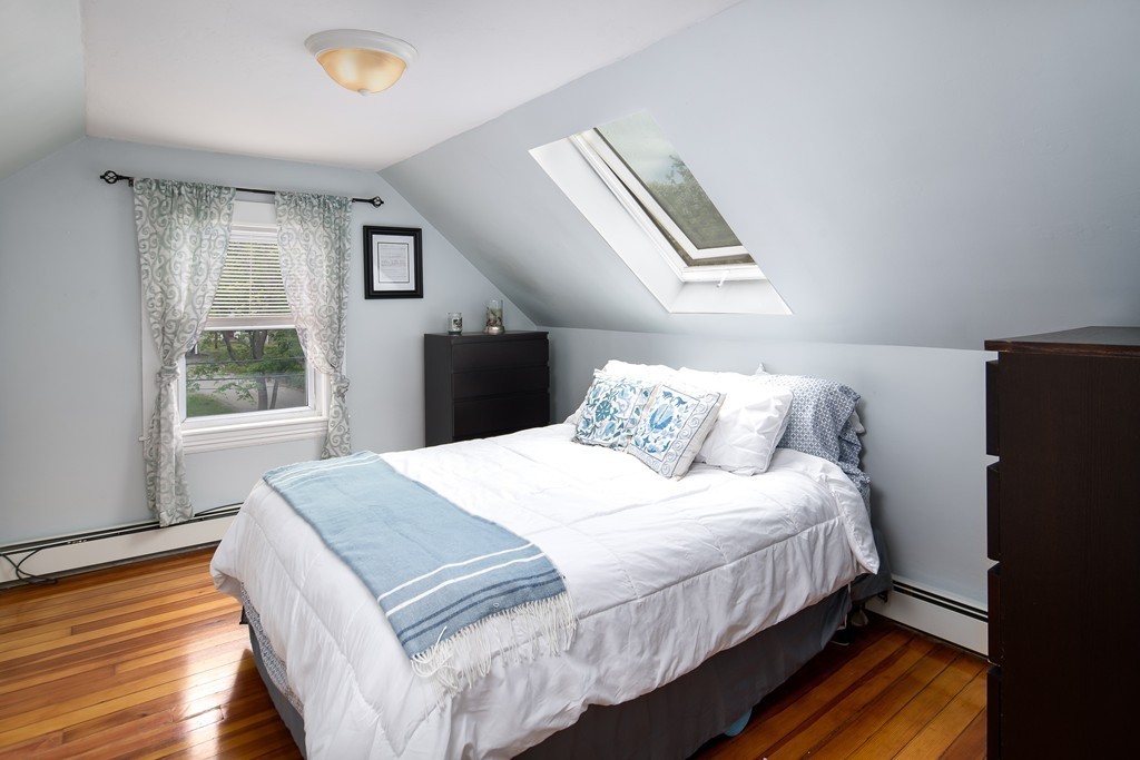 79 Colonial Drive Dedham, MA 02026 - Photo 6 of 12 a bedroom with bed and wooden floor