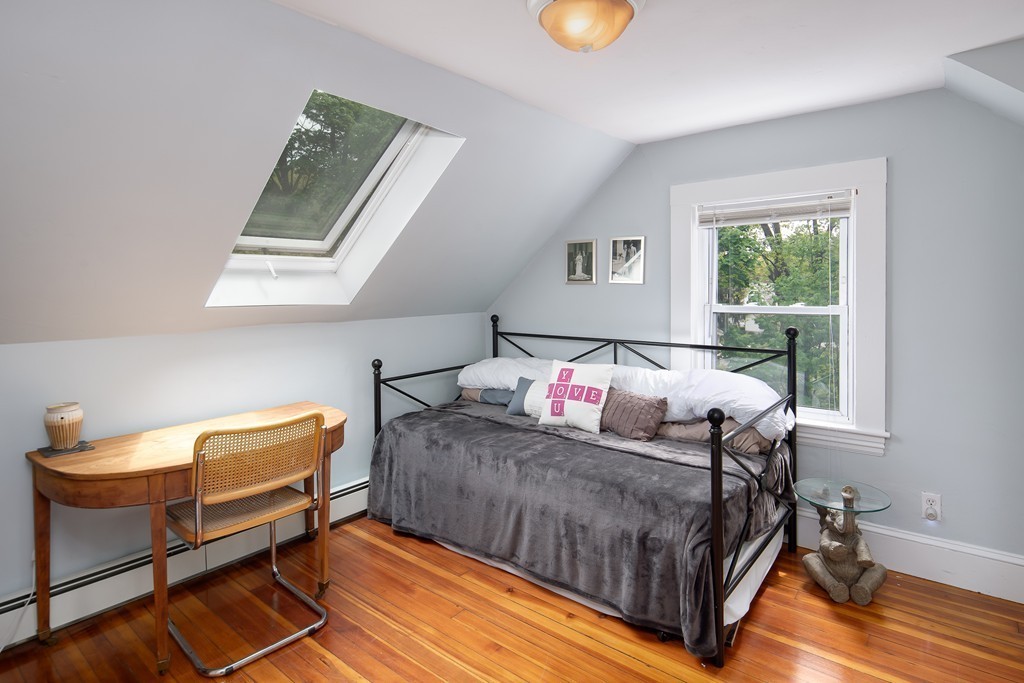 79 Colonial Drive Dedham, MA 02026 - Photo 7 of 12 a living room with a bed and a window