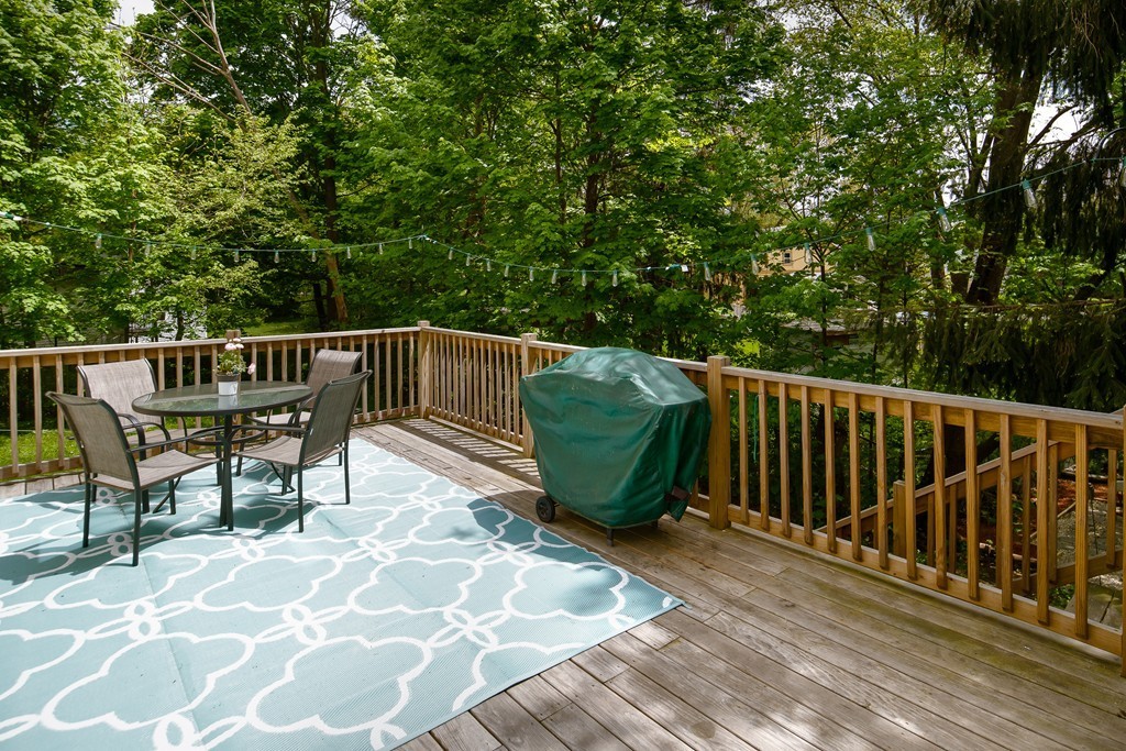 79 Colonial Drive Dedham, MA 02026 - Photo 10 of 12 a view of a chairs and table on the wooden floor