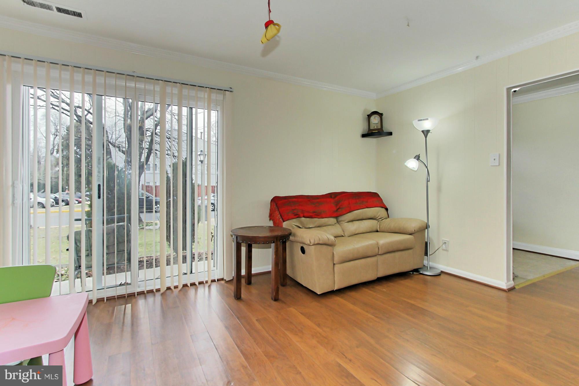 6340 Rockshire Street Alexandria, VA 22315 - Photo 14 of 30 a living room with furniture and a large window