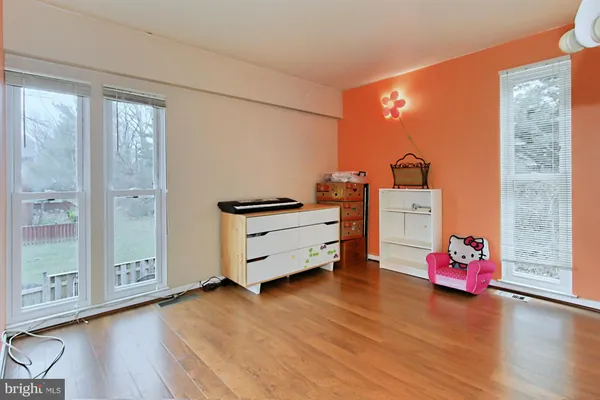 a bedroom with a bed and a table in it