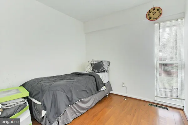 a living room with lots of furniture and baby bed