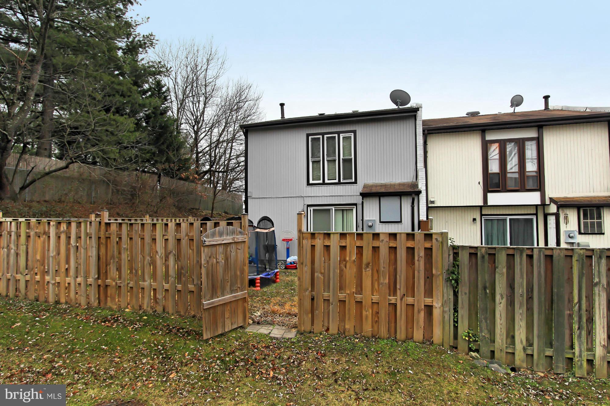 6340 Rockshire Street Alexandria, VA 22315 - Photo 28 of 30 a view of a small house with wooden fence