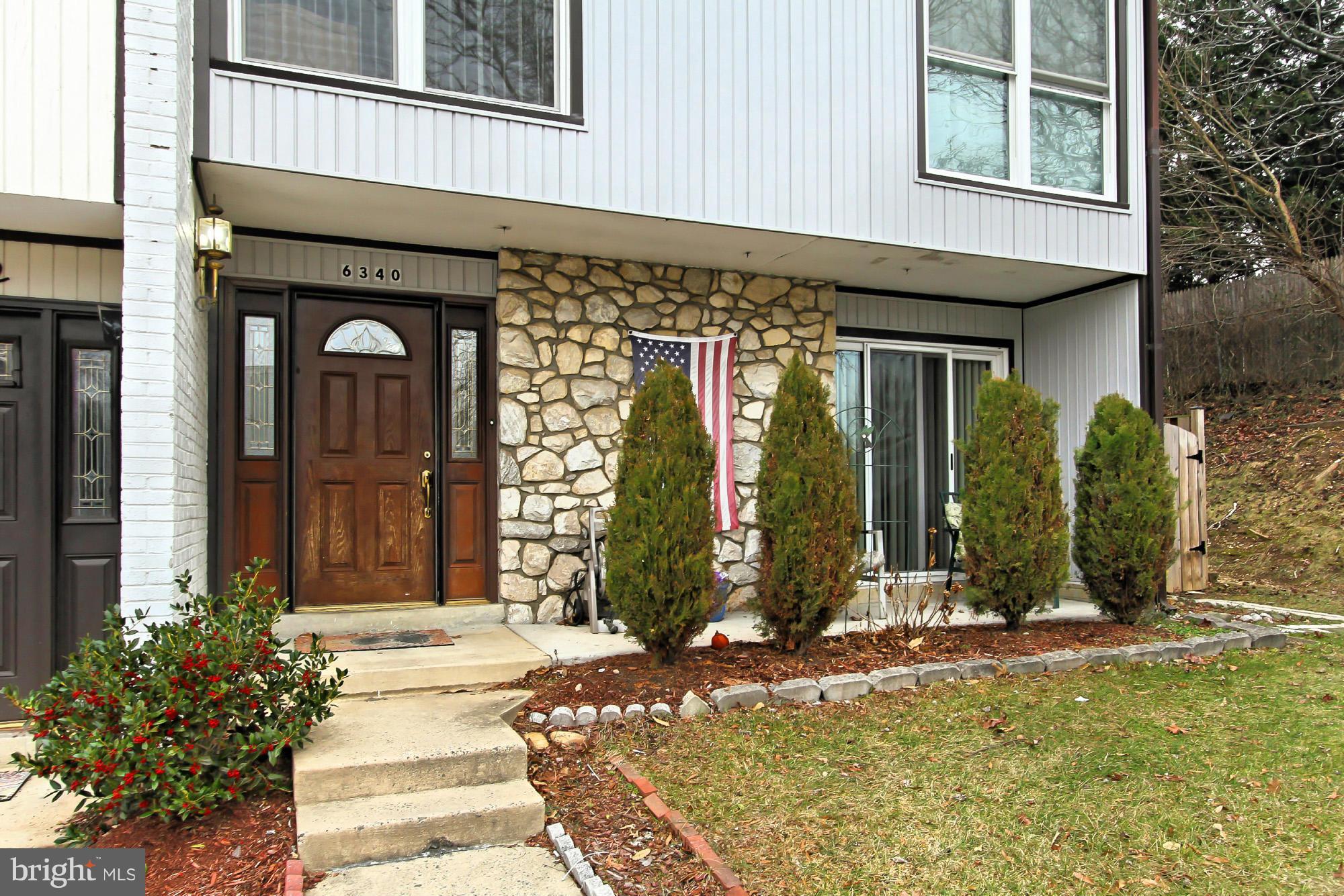 6340 Rockshire Street Alexandria, VA 22315 - Photo 4 of 30 a front view of a house with a yard