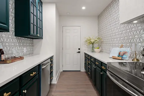 a kitchen with a sink and stove
