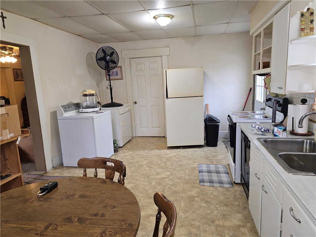 457 Wolf Road West Alexandria, OH 45381 - Photo 13 of 28 This functional kitchen provides a practical space for daily living and culinary activities.